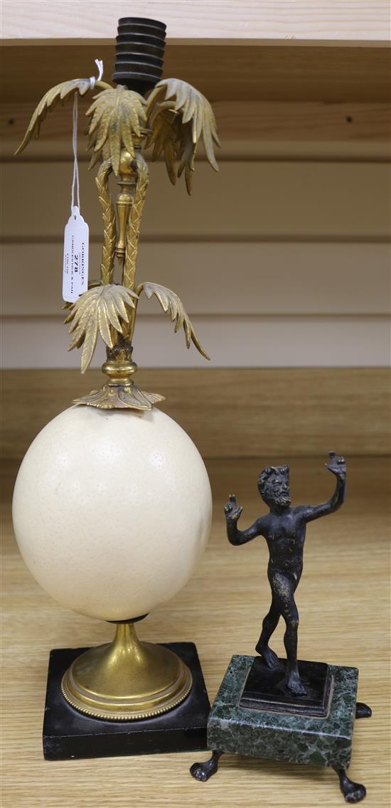 An ormolu egg candlestick and a bronze of a Pan, H.34cm